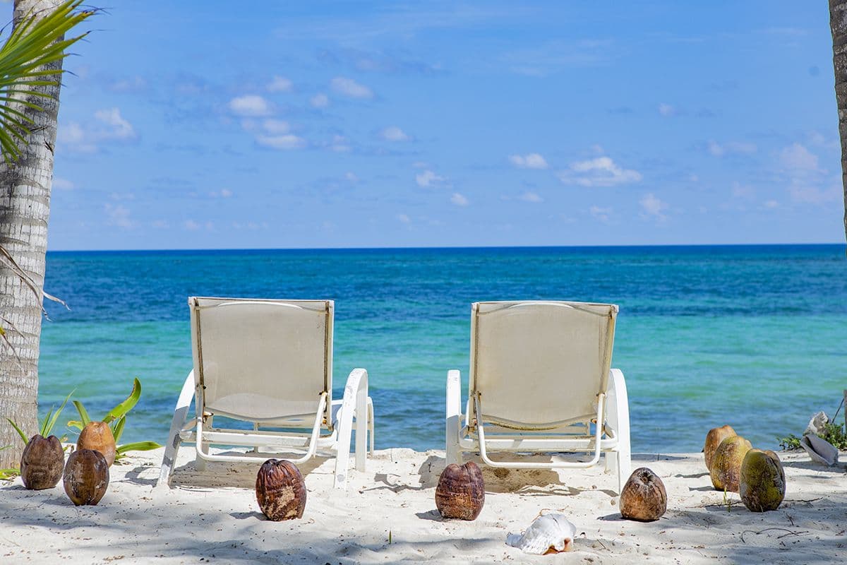 Beach chairs on white sand