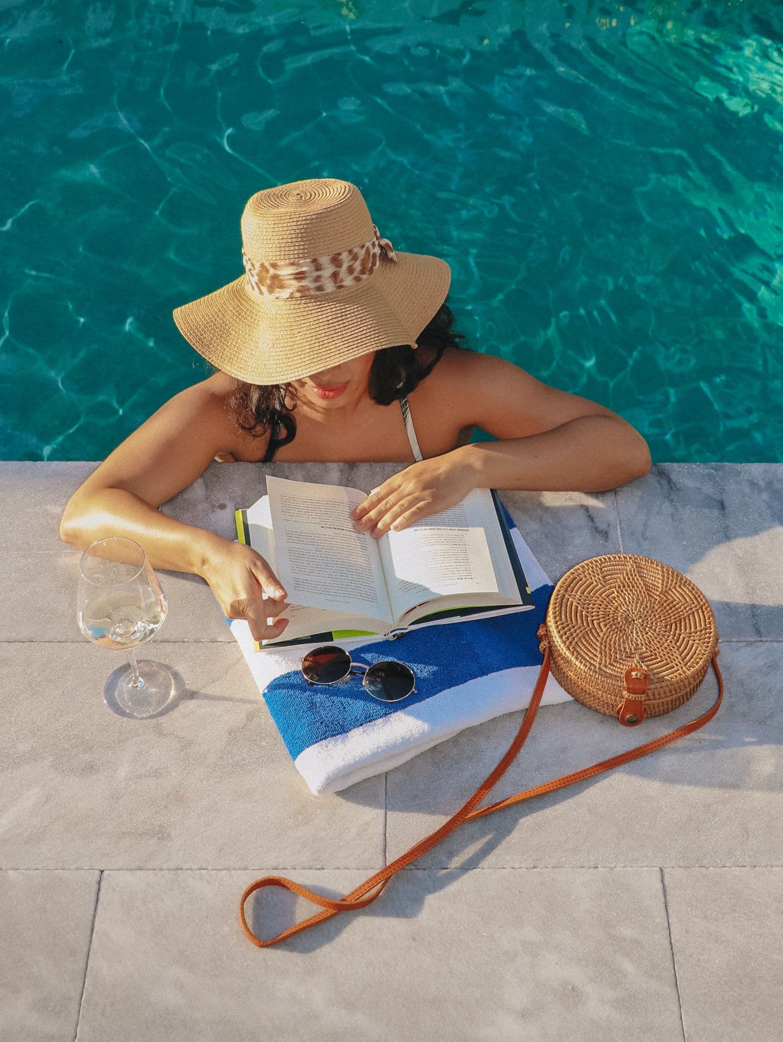 Guest reading by the pool